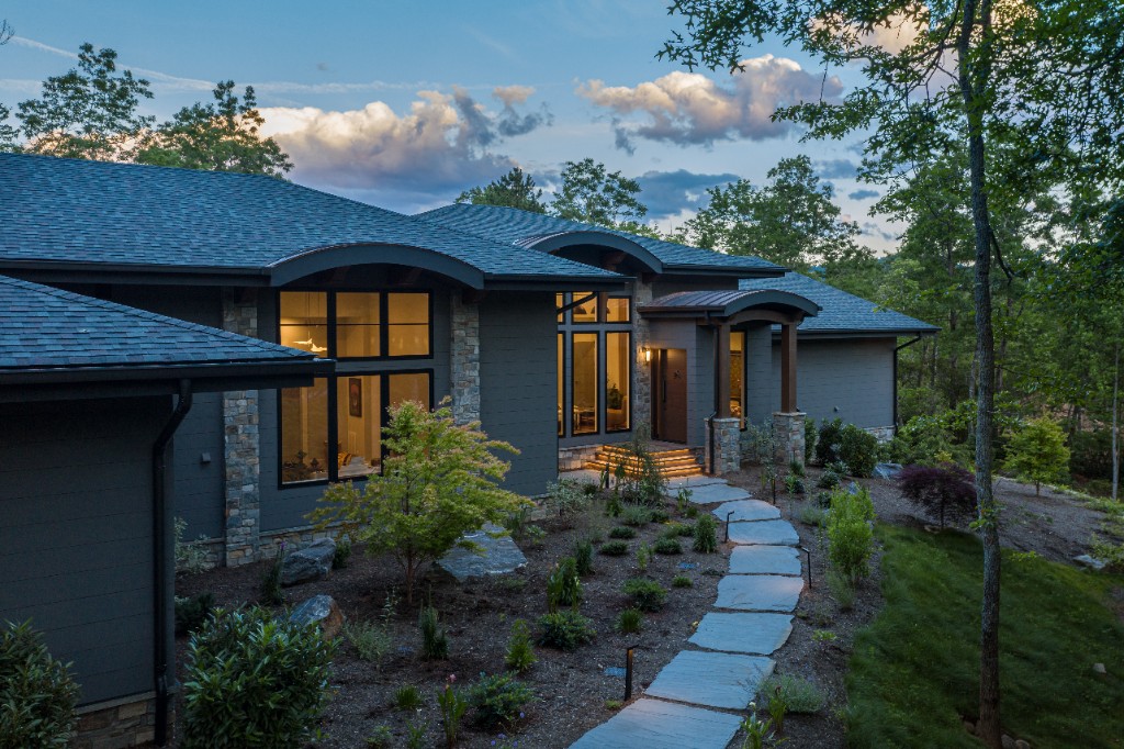 Greener Living custom home exterior at dusk